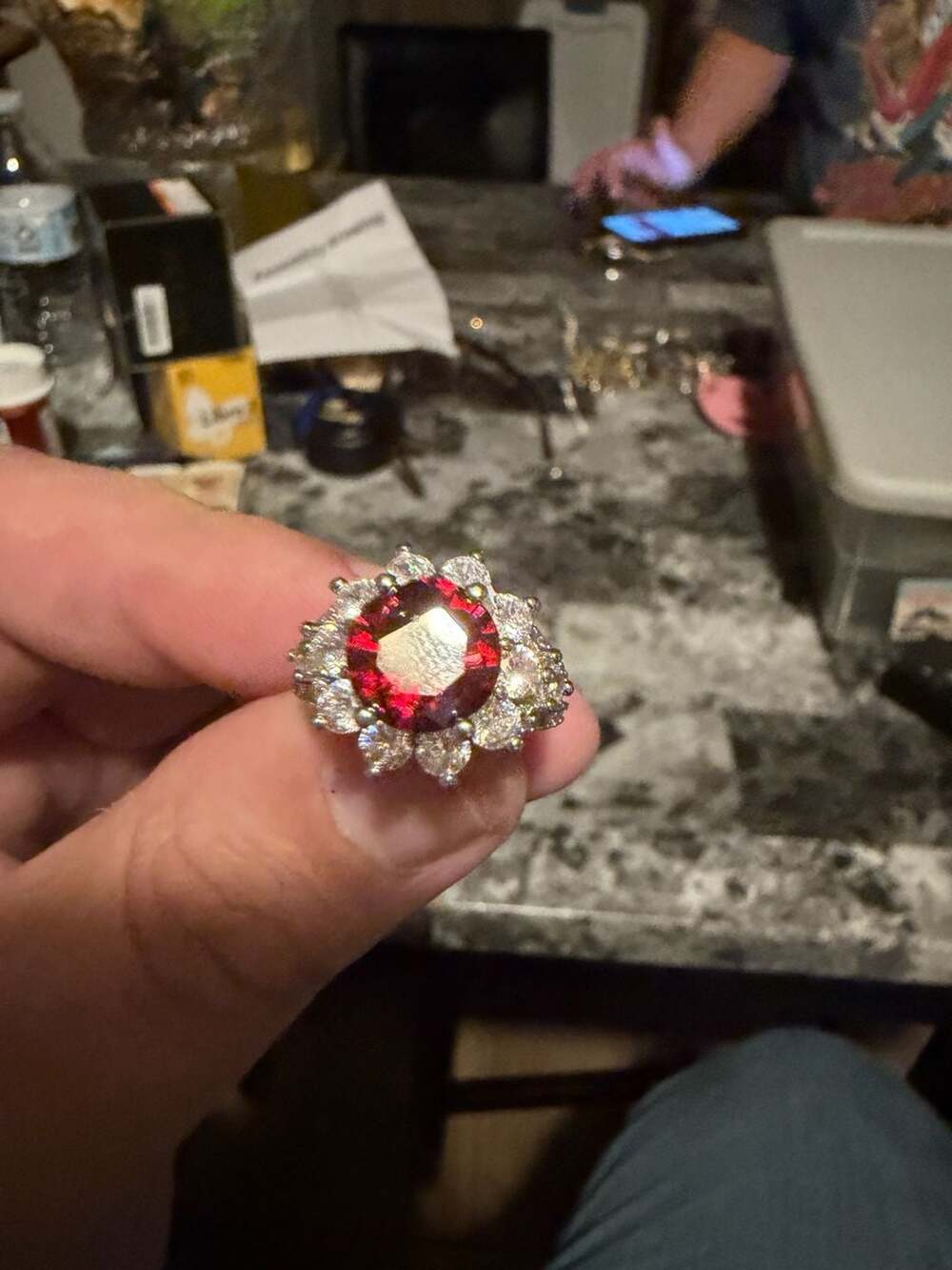 Vintage Oval Red Gemstone Halo Ring with Cubic Zirconia Accents